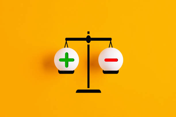 Plus and minus or positive and negative symbols are in balance on a scale with yellow background.